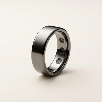 Titanium smart ring on a warm off-white background