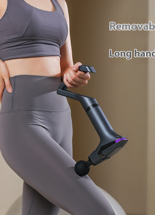 Person wearing gray athletic wear holding a black and purple exercise device with text 'Removable Long handle'.