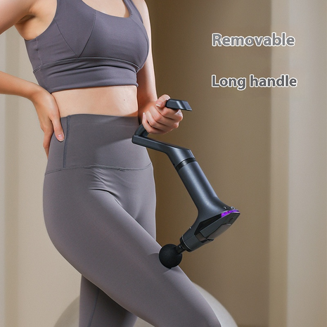 Person wearing gray athletic wear holding a black and purple exercise device with text 'Removable Long handle'.
