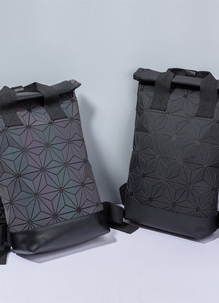 Two black geometric-patterned backpacks on a light gray background