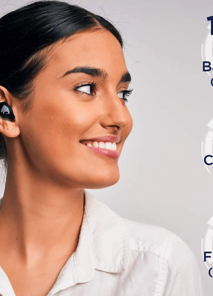 Woman wearing wireless earbuds with battery life information displayed.