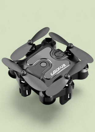 Mini folding drone with remote control, foldable compact design, HD camera, and USB charging cable