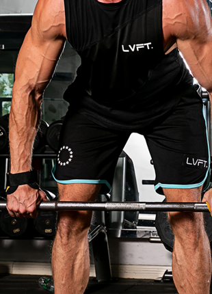 Person lifting weights in a gym wearing leather grips