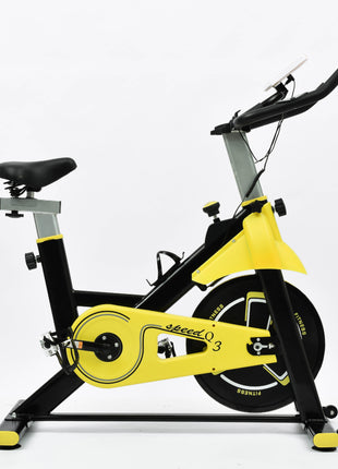 Yellow and black exercise bike on a white background
